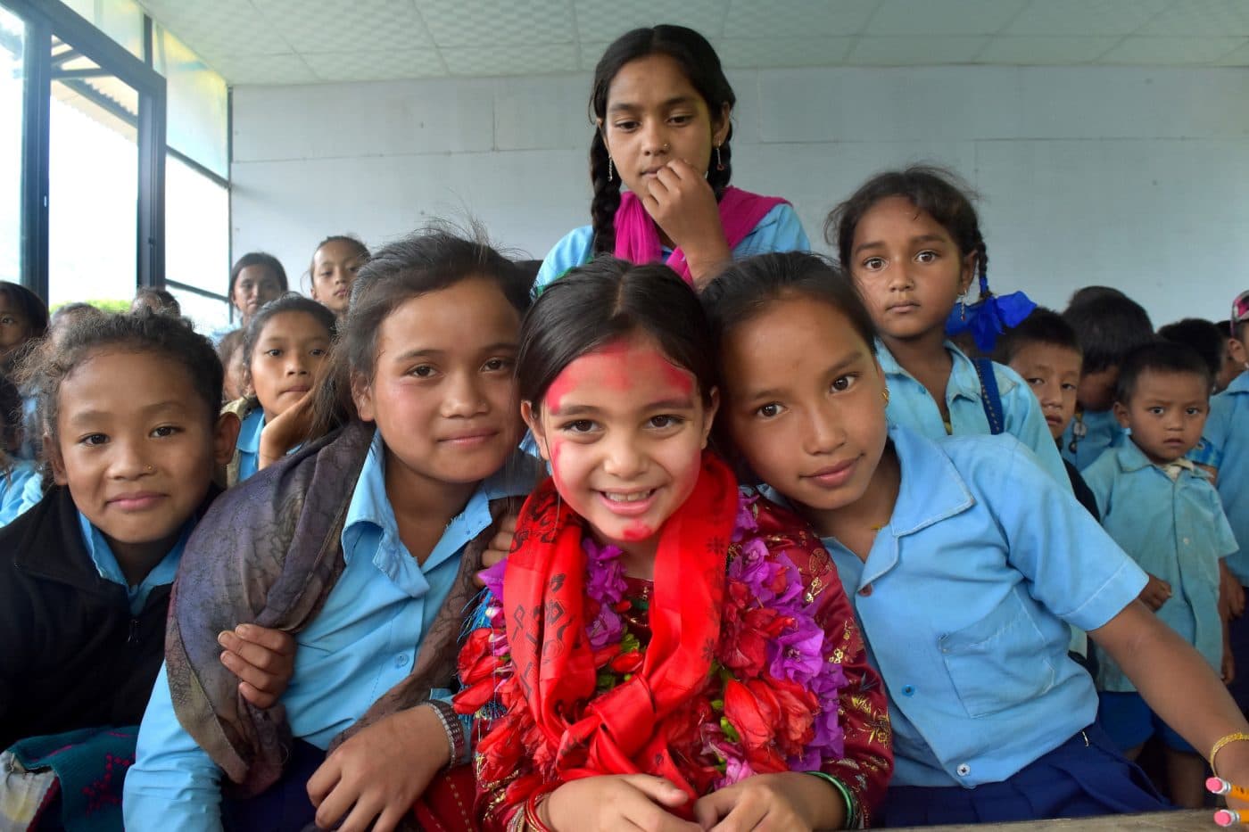 Students gathered outside the rebuilt school in Gorkha, Nepal